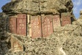 Medieval khachkars installed on the wall of the cave Church in the mountains of Geghama ridge,on the territory of Geghard monaster