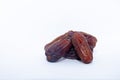 A group of medjool dates bottom right from Saudi Arabia on an  white background for Ramadan Royalty Free Stock Photo