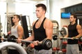 Group of men with barbells in gym Royalty Free Stock Photo