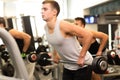 Group of men with barbells in gym Royalty Free Stock Photo