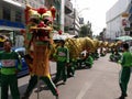 A group of men carrying a large dragon in a Festival of the Clans of the Chinese community of Bangkok