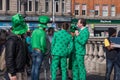 Group of men in green clothes and Irish hats on O`Connell Street in Dublin, Ireland on St. Patrick`s Day Royalty Free Stock Photo