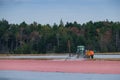 Cranberry Harvest - men and a tractor