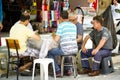 A Group Of Men Are Playing Card Game