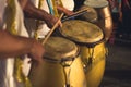 Group of men playing yellow drums at carnival parade