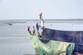 Group of Men Repairing Fisherman Ship