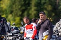 A group of men on a social gathering are preparing to ride an ATV quad bike. People Ride together on a quad atv on muddy Royalty Free Stock Photo