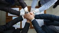 Group men in suits hold out their hands in unity Royalty Free Stock Photo