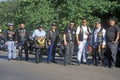 A group of men with their Harley Davidsons from the Latin American Motorcycle Association take a break in Dallas, Texas during the Royalty Free Stock Photo