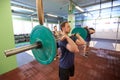 Group of men training with barbells in gym Royalty Free Stock Photo