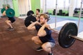 Group of men training with barbells in gym Royalty Free Stock Photo