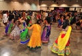 Group of Men and women are dancing and enjoying Hindu festival of Navratri Garba wearing traditional consume.