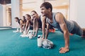 Group men and women performs a physical exercise. Royalty Free Stock Photo