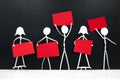 Group of men and women stick figure holding red blank placards in black background. Activism, protest, demonstration concept.