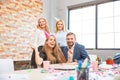 A group of men and women working in the office, eating pizza in a festive mood. Royalty Free Stock Photo