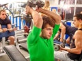 Group of men working his body at gym. Royalty Free Stock Photo