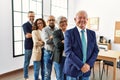 Group of middle age business workers smiling happy standing with arms crossed gesture at the office Royalty Free Stock Photo