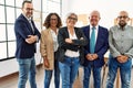 Group of middle age business workers smiling happy standing with arms crossed gesture at the office Royalty Free Stock Photo