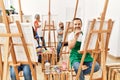 Group of middle age draw students smiling happy drawing at art studio Royalty Free Stock Photo