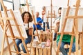 Group of middle age draw students smiling happy drawing at art studio Royalty Free Stock Photo