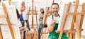 Group of middle age draw students smiling happy drawing at art studio Royalty Free Stock Photo