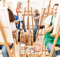 Group of middle age draw students smiling happy drawing at art studio Royalty Free Stock Photo