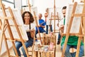 Group of middle age draw students smiling happy drawing at art studio Royalty Free Stock Photo