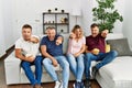 Group of middle age people sitting on the sofa at home pointing displeased and frustrated to the camera, angry and furious with Royalty Free Stock Photo
