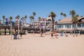 Group of middle aged caucasian men playing volleyball on the beach near the Huntington Beach Pier Royalty Free Stock Photo