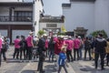 A group of middle-aged and old-aged tourists who listened to tour guides at Wuyi Lane