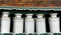 Group of Milk Cans on Fancy Green Shelf