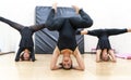 Group of millennial female athletes training synchronized exercises