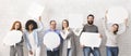 Group of millennial people holding empty speech bubbles Royalty Free Stock Photo