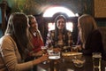 Group of millennial women having fun drinking beer