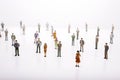 Group of miniature people over white background. Royalty Free Stock Photo
