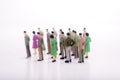 Group of miniature people over white background. Royalty Free Stock Photo