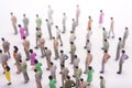 Group of miniature people over white background. Royalty Free Stock Photo