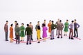 Group of miniature people over white background. Royalty Free Stock Photo