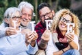 Group of mixed ages generations people smiling and showing blocks letters with  life word -  happy lifestye enjoying the outdoor Royalty Free Stock Photo