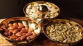 A group of mixed nuts in a golden bowl Royalty Free Stock Photo