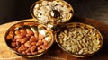 A group of mixed nuts in a golden bowl Royalty Free Stock Photo