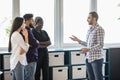 Group of mixed race Businesspeople having informal office meeting Royalty Free Stock Photo