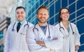 Group Of Mixed Race Male and Female Doctors or Nurses by Hospital Royalty Free Stock Photo