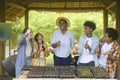 Group of mixed race students and teacher learning agriculture technology in smart farming , education ecology agricultural