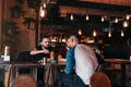 Group of mixed race young men talking and laughing in lounge bar. Multiracial friends having fun in cafe Royalty Free Stock Photo