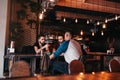 Group of mixed race young men talking in lounge bar. Multiracial friends having fun in cafe Royalty Free Stock Photo