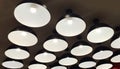Group of Modern Black Metal Illuminated Lamps Hanging on The Ceiling Royalty Free Stock Photo