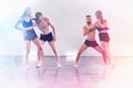 Group of modern male and female street dancers performing different moves in the studio. Effective performance. Beautiful dance Royalty Free Stock Photo