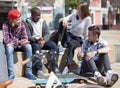 Group of modern teens chatting in the yard