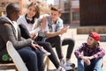 group of modern teens chatting in the yard